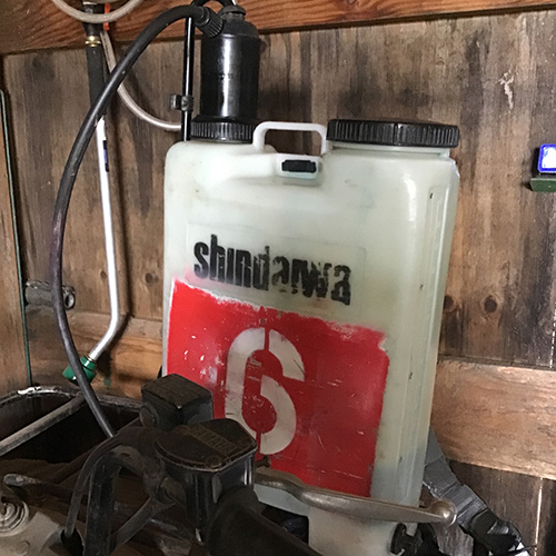 Backpack sprayer with red paint marking