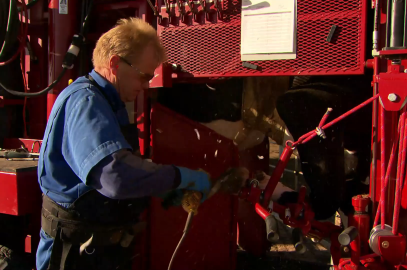 image of worker using machine