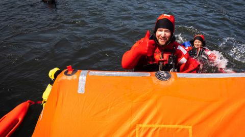 Image of a fisherman in an immersion suit